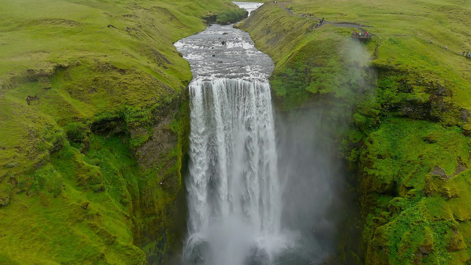 Aerial view over the brink of Skogafoss waterfall in Iceland